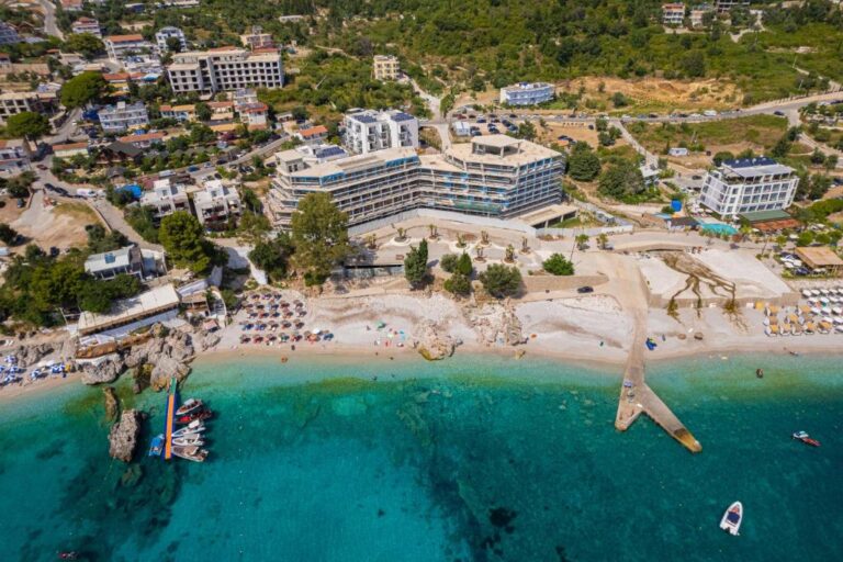 Patio mare in Albania droneview shot from the entire hotel and coastline