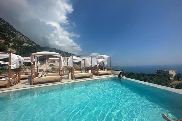 amare hotel poolside view on the ocean and the underlying buildings