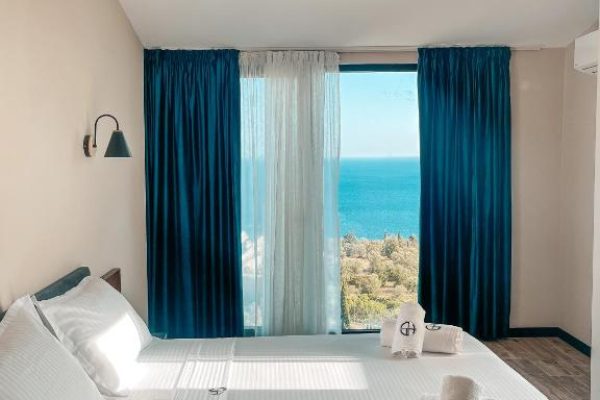 gogo's boutique hotel masterbedroom with seaside view and all the necessities