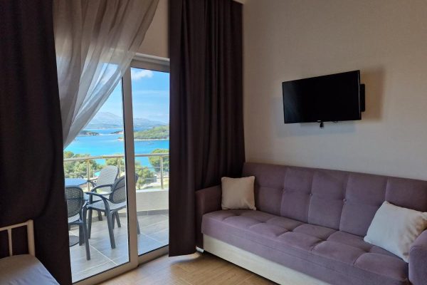 Hotel Queen Margaret Seaside in Ksamil livingroom and balcony